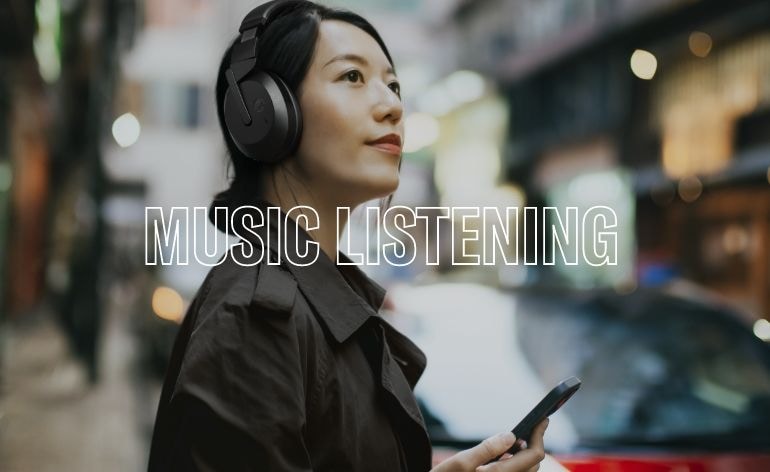 Lifestyle image showing a woman wearing Yamaha YH-E700B black color headphone